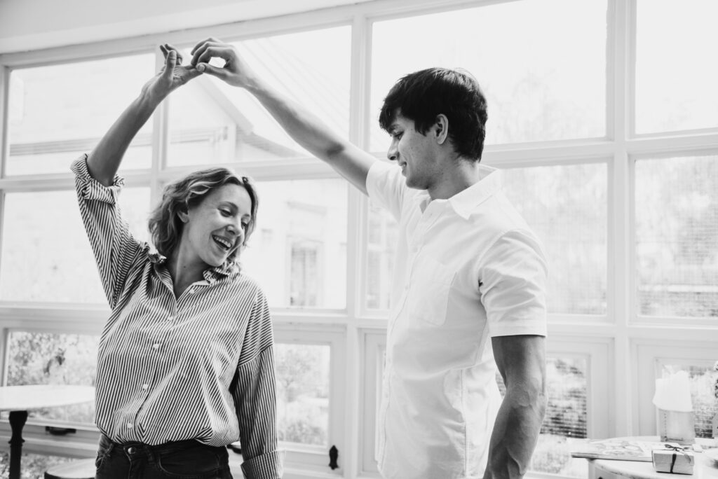 cheerful-couple-enjoy-dancing-together